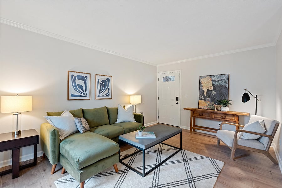 Another view of the spacious living room. Sofa-seats three, plus has chaise lounge, and two other chairs. 