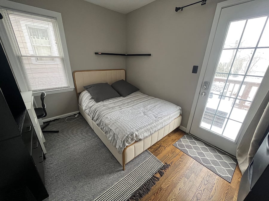 Full-size bed with storage below.