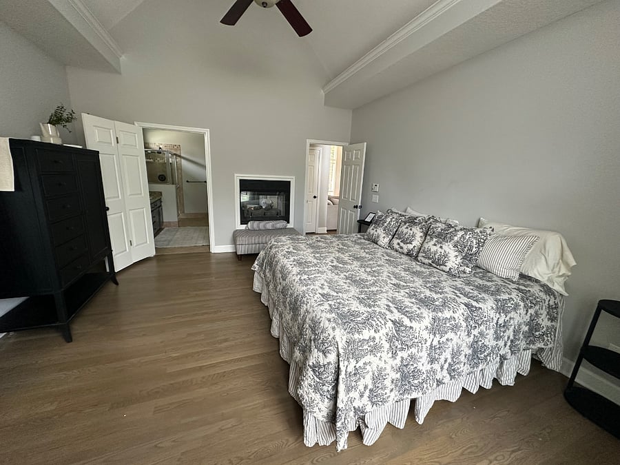 King bed adjustable master suite with see through fireplace to bathrub