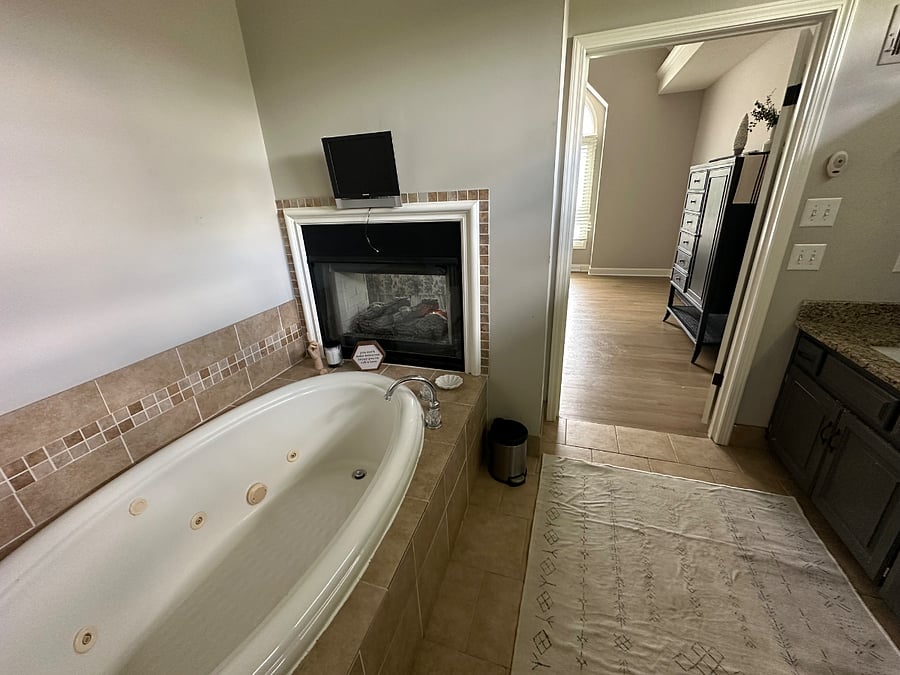 Master suite jetted garden tub with see through fireplace