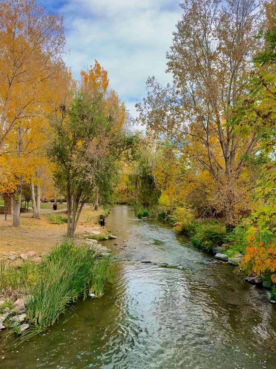 Pueblo Riverwalk waterfall, beautiful area with benches in the trees
