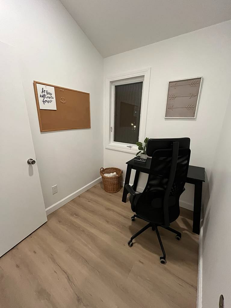 Shared office space with writing desk for laptops