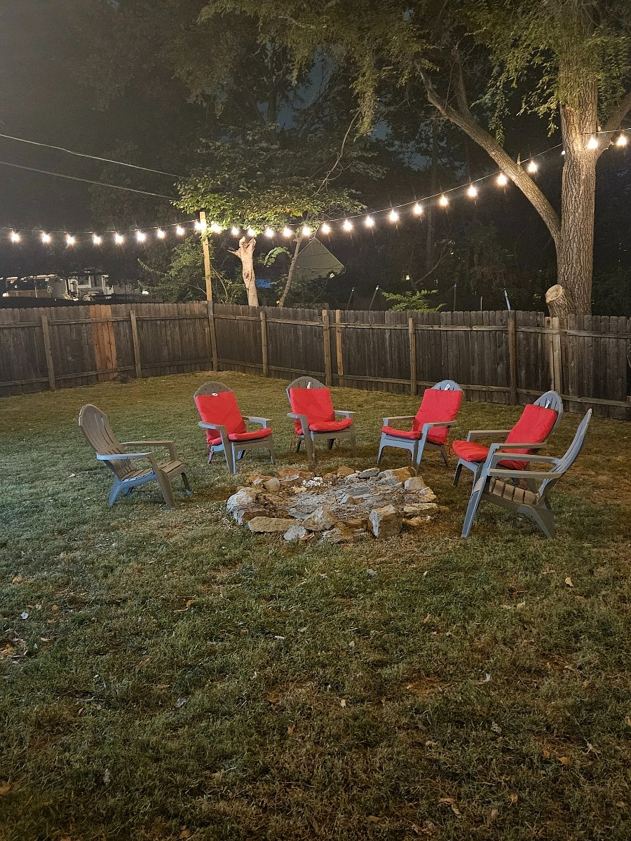 Fire pit, Adirondack chairs and yard lights by the back patio for you to enjoy!