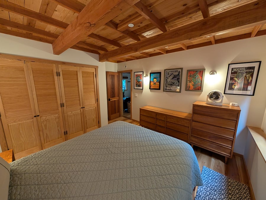 Bedroom with new Queen size bed, the doors on the left are the closet