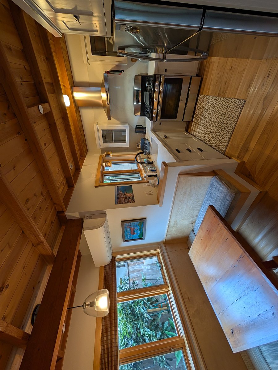 Breakfast nook and kitchen.  You can also see the mini split mounted on the wall in the breakfast nook, it has air conditioning as well as a heat pump.