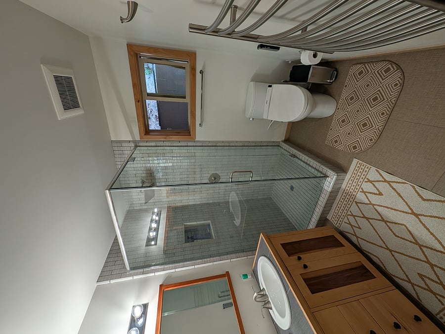 Bathroom with heated towel rack on the right 