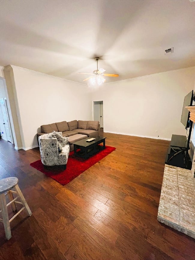 Large open living room with great outdoor lighting and large flat screen TV