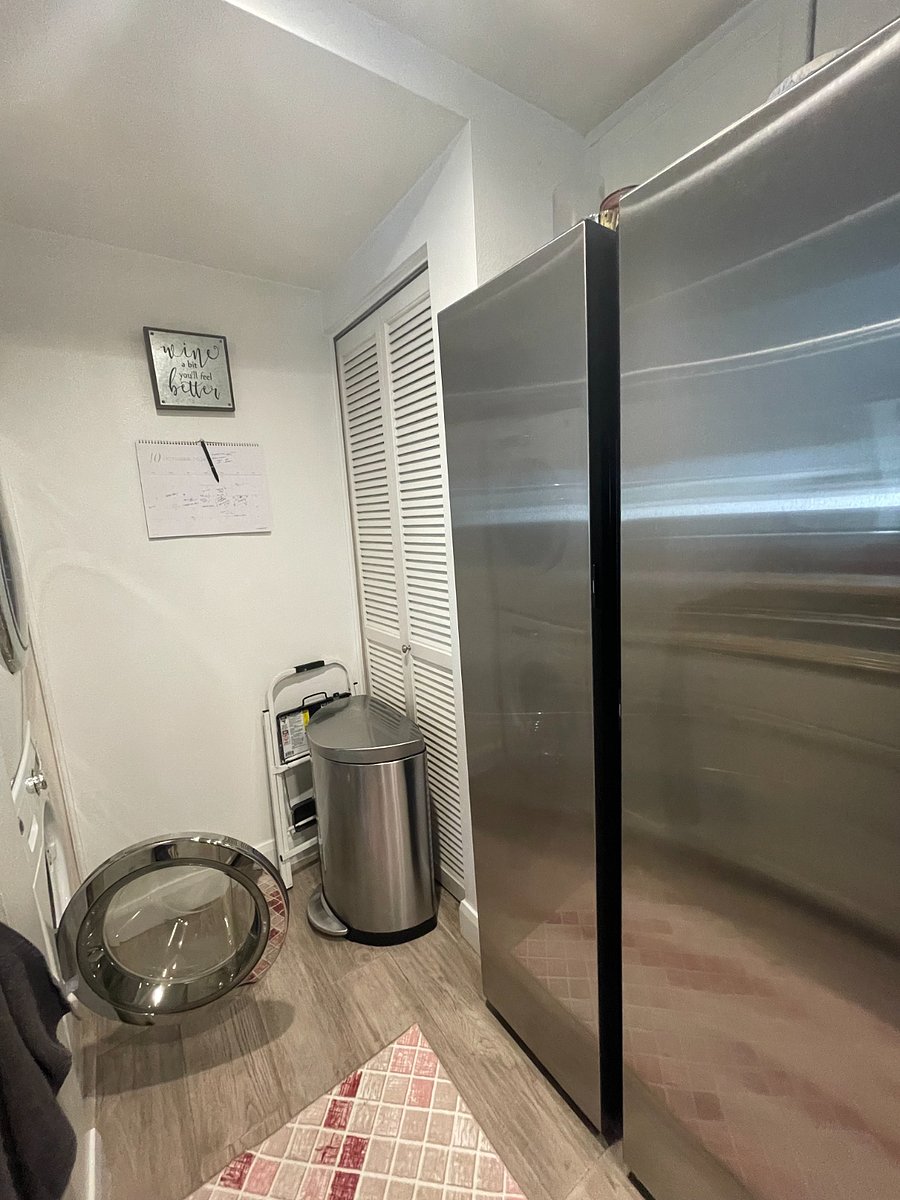 Simple Human trash can with brand new samsung fridge (Feb. 2024) and freezer. Freezers boasts two types of ice cubes