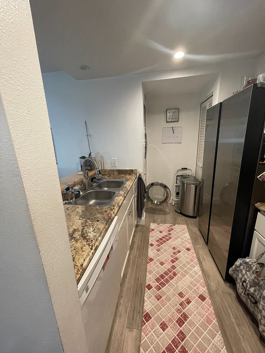 Kitchen with stackable washer dryer less than 5 years old