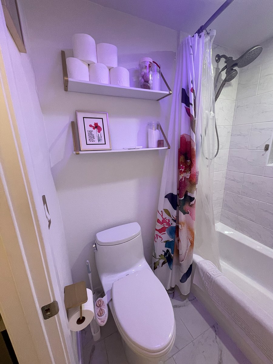 beautifully updated bathroom with new toilet, cast iron tub and dual shower head set for 6'5 height
