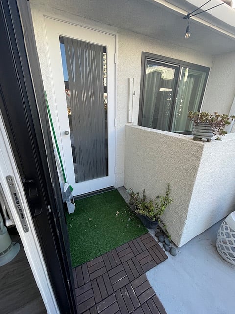 Faux grass area we made for our pup to sunbathe (NOT for relief)