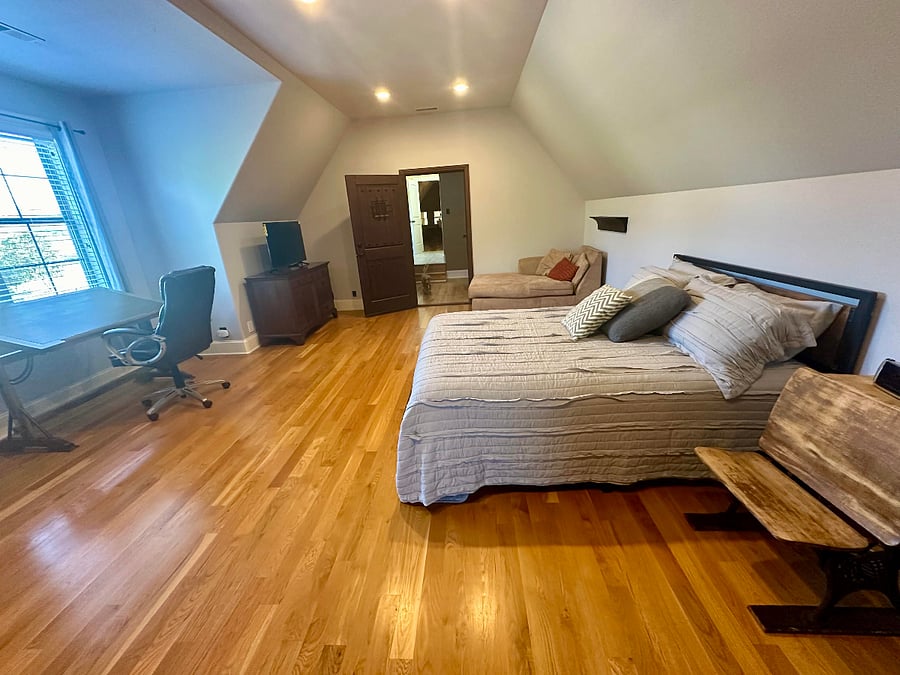 Bedroom with lounge area and dedicated work space
