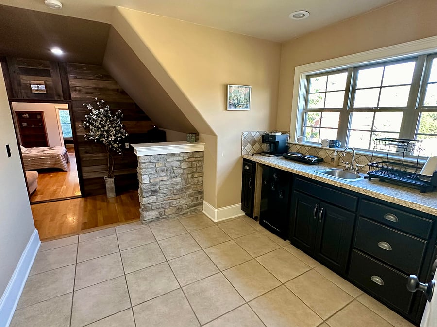 This is the first room you walk into within your private suite upstairs. To your left is the full private bathroom and to your right is the wet bar, mini fridge, and coffee bar.