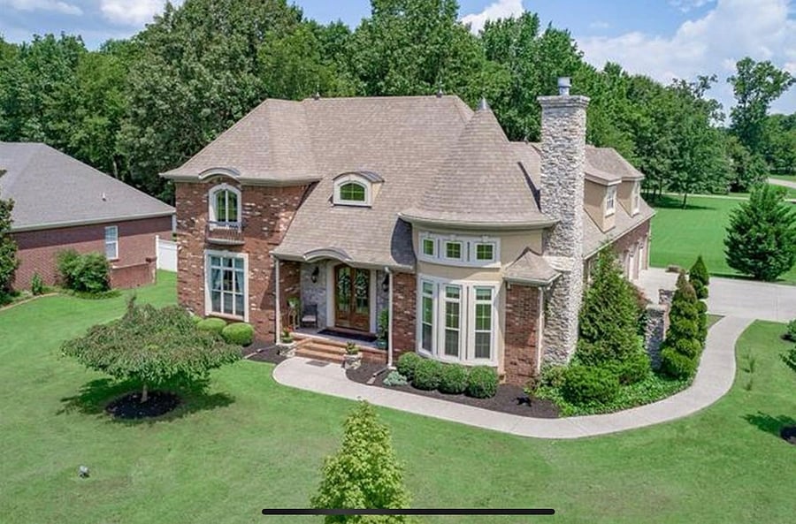 Aerial view of the exterior of the home. Your rental suite is located behind the tourette and extended all the way back over the garage.