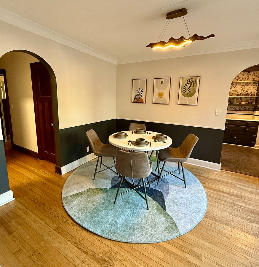 From kitchen into dining room, the hallway on the left leads to in-unit laundry, bedrooms, bathrooms, and office.