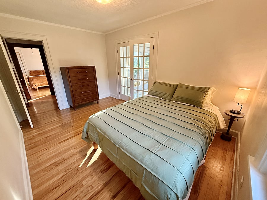 This bedroom has the attached office room/sunroom.