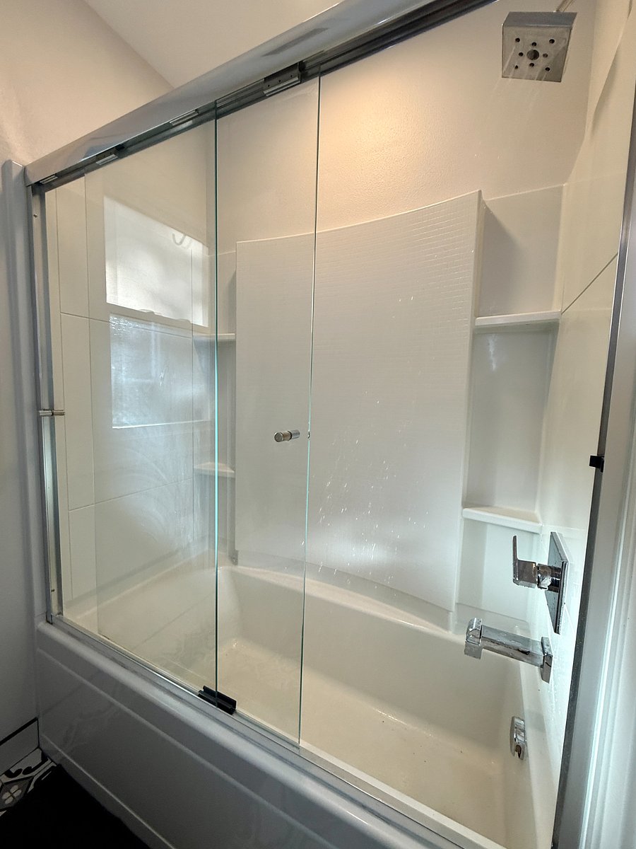 First Full Bathroom at the end of the hallway between the In-Unit Laundry and First Bedroom.
