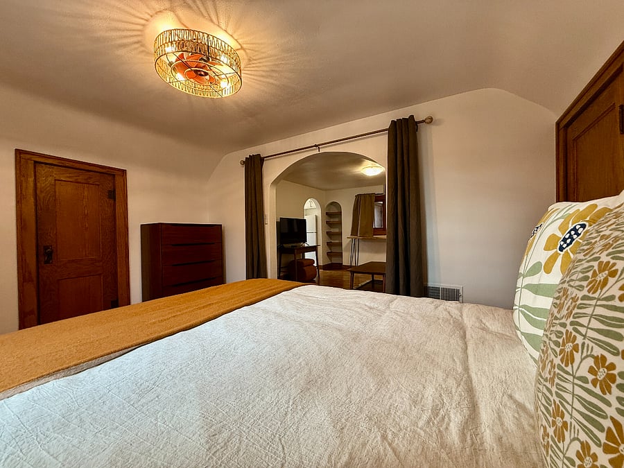 Bedroom with plush Queen bed.