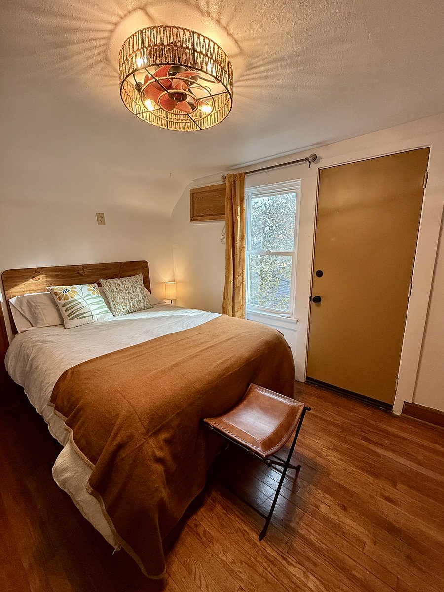 Bedroom with Black Out Curtains and second entrance to the Private Deck.