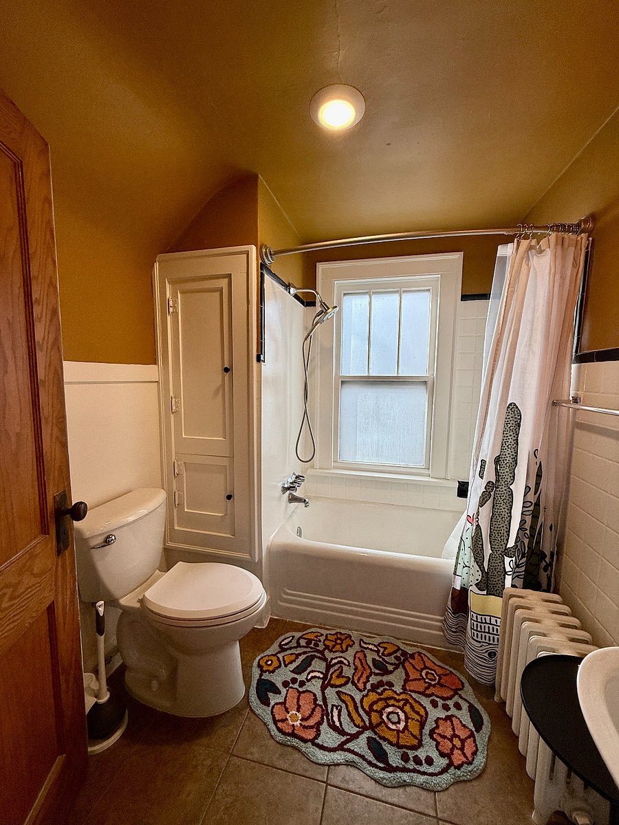 Updated shower fixtures with good water pressure, plus built-ins for towels and bathroom essentials.