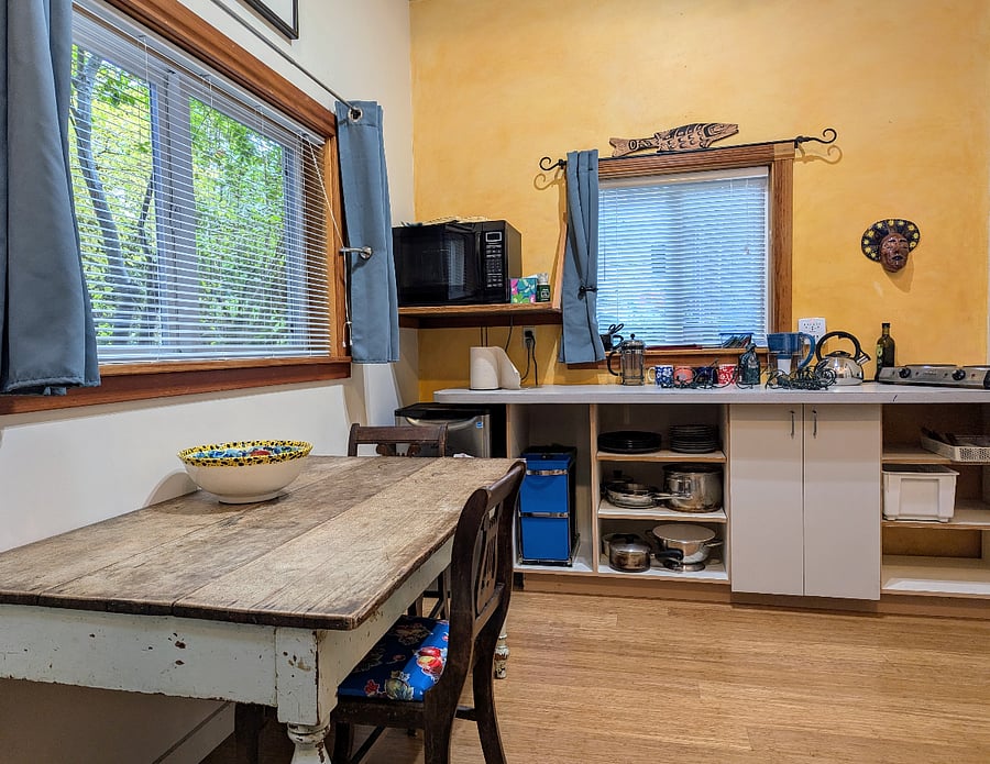 Kitchen + work table, well stocked kitchenette