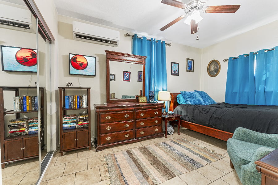 Bedroom with large chest of drawers/lots of storage.
