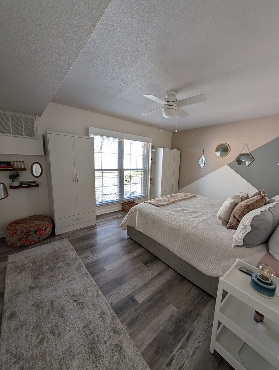 bedroom 1: king sized bed, hanging storage wardrobe (left) and shelf storage wardrobe (right)