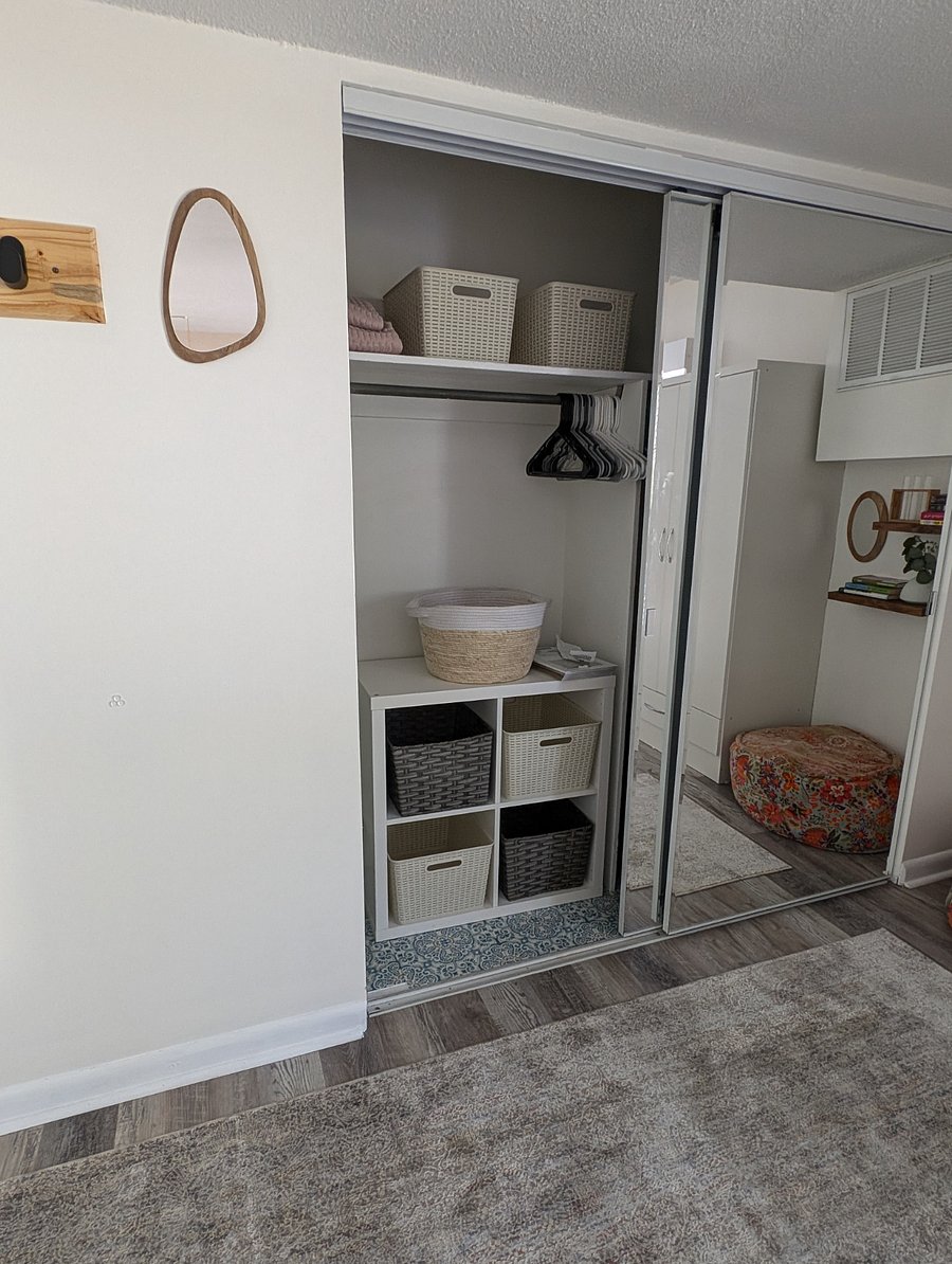 bedroom 1: full closet with sliding doors