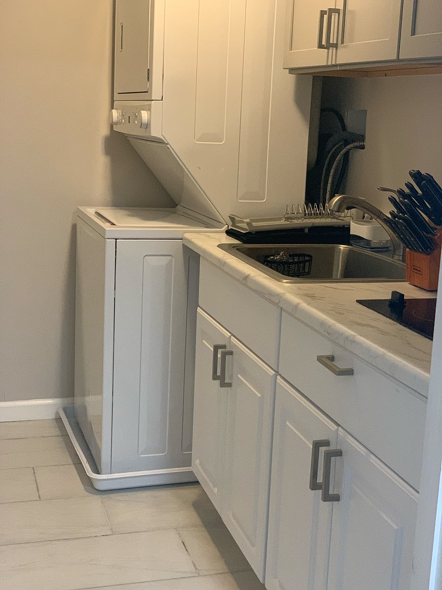 well-appointed washroom, a fully equipped kitchen with modern appliances, and all essential utilities for a comfortable and convenient stay