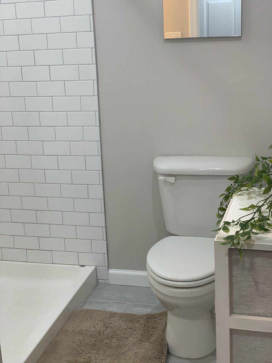 Full bathroom featuring modern, functional amenities designed for both style and convenience