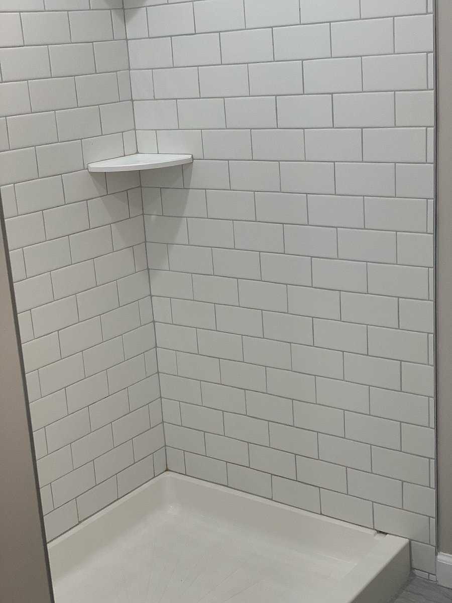 Full bathroom featuring modern, functional amenities designed for both style and convenience."