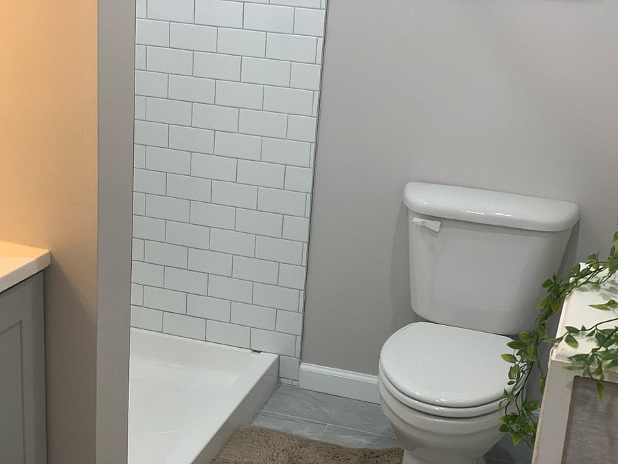 Full bathroom featuring modern, functional amenities designed for both style and convenience."