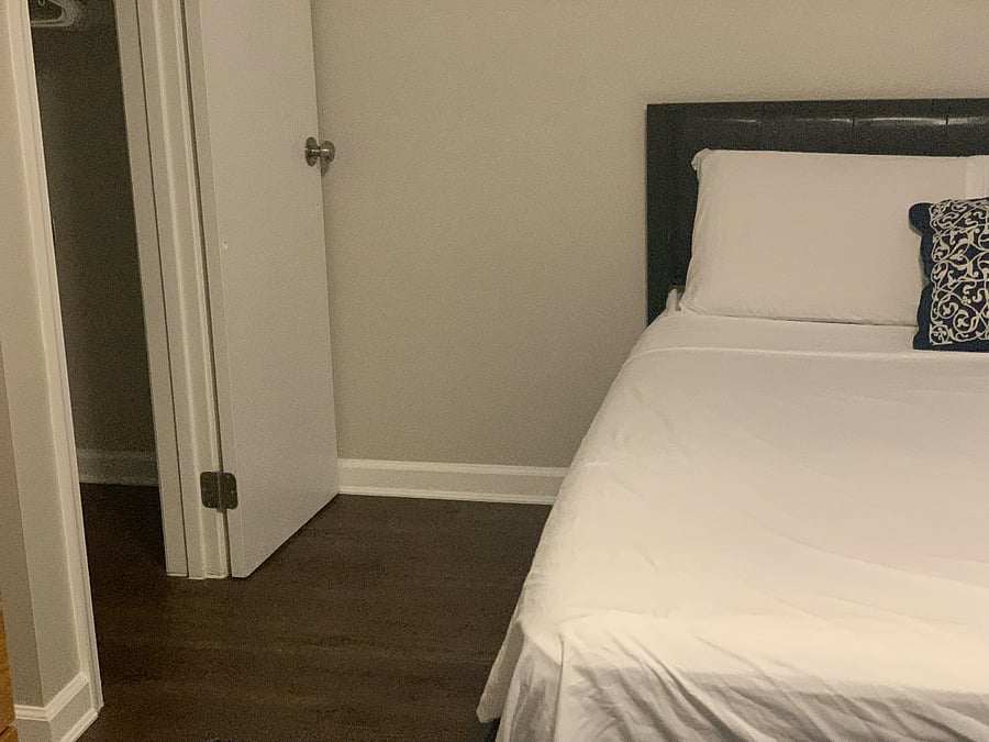 One-bedroom featuring a queen-sized bed and a dedicated desk area