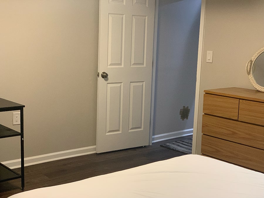 One-bedroom featuring a queen-sized bed and a dedicated desk area