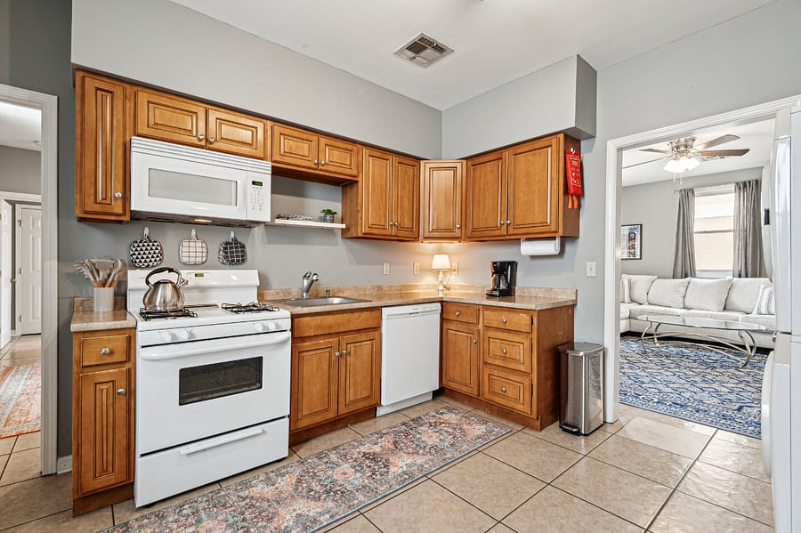 The kitchen is fully stocked with all cooking essentials, including dinner ware, pots and pans, a coffee maker, and more!