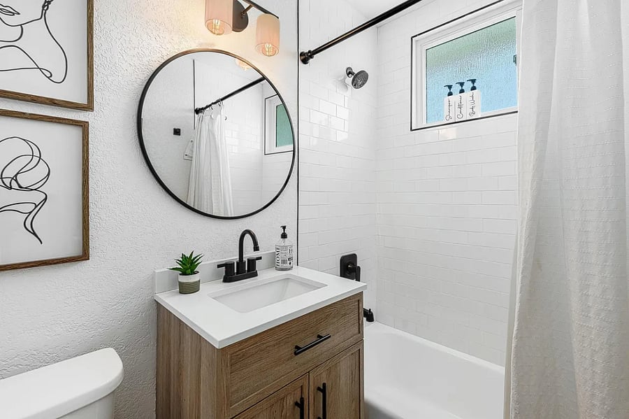 The secondary bathroom features a shower and bathtub combo, great for both quick rinses and long soaks.