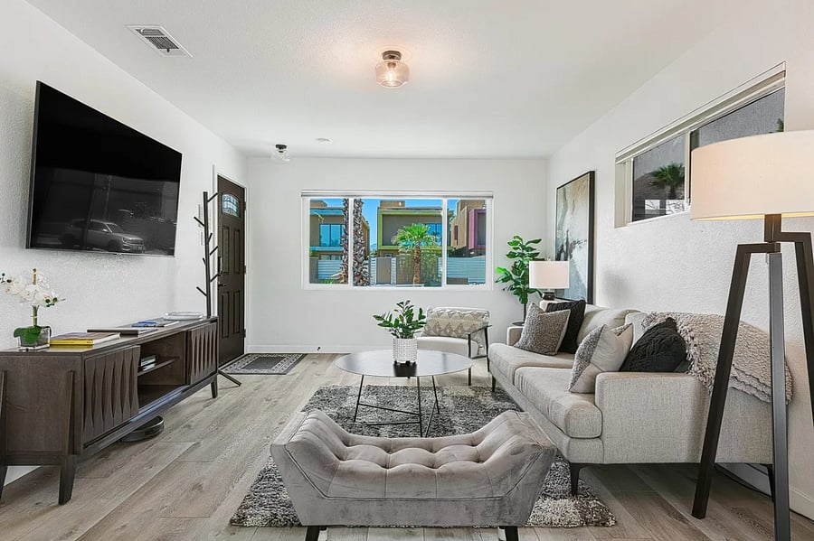 Soft seating and natural light create a welcoming space to relax or entertain.