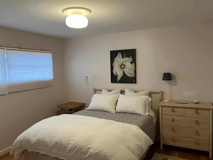 Queen bed with dresser, chair, spacious closet. Blackout shades newly installed.
