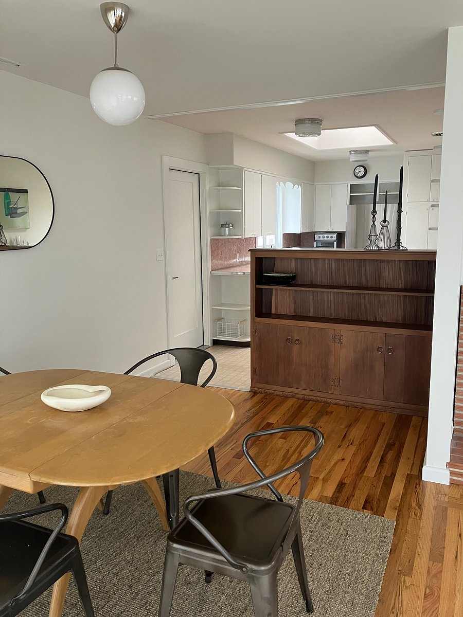 Open dining room and kitchen. Door into garage and laundry.