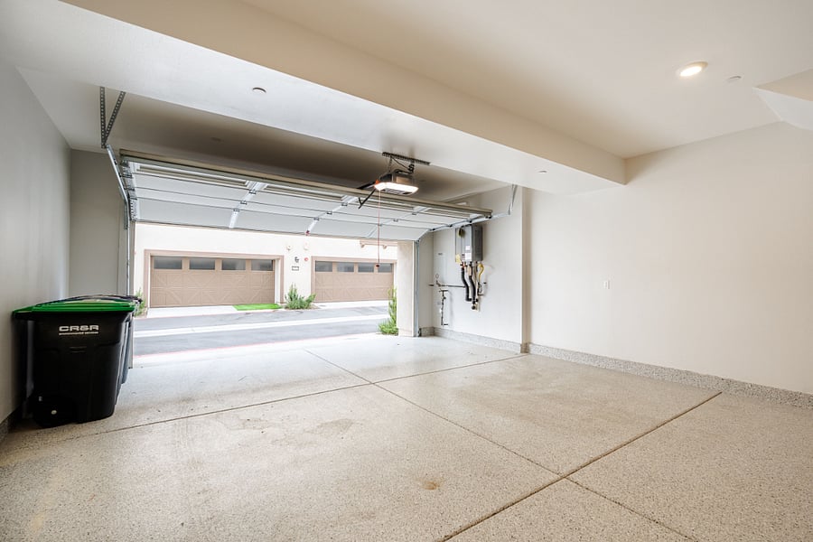 Oversized 2 car garage | storage | extra fridge | enter into first level to den | EV charger