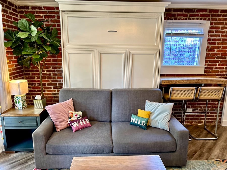 Sofa that converts into Queen size memory foam murphy bed.