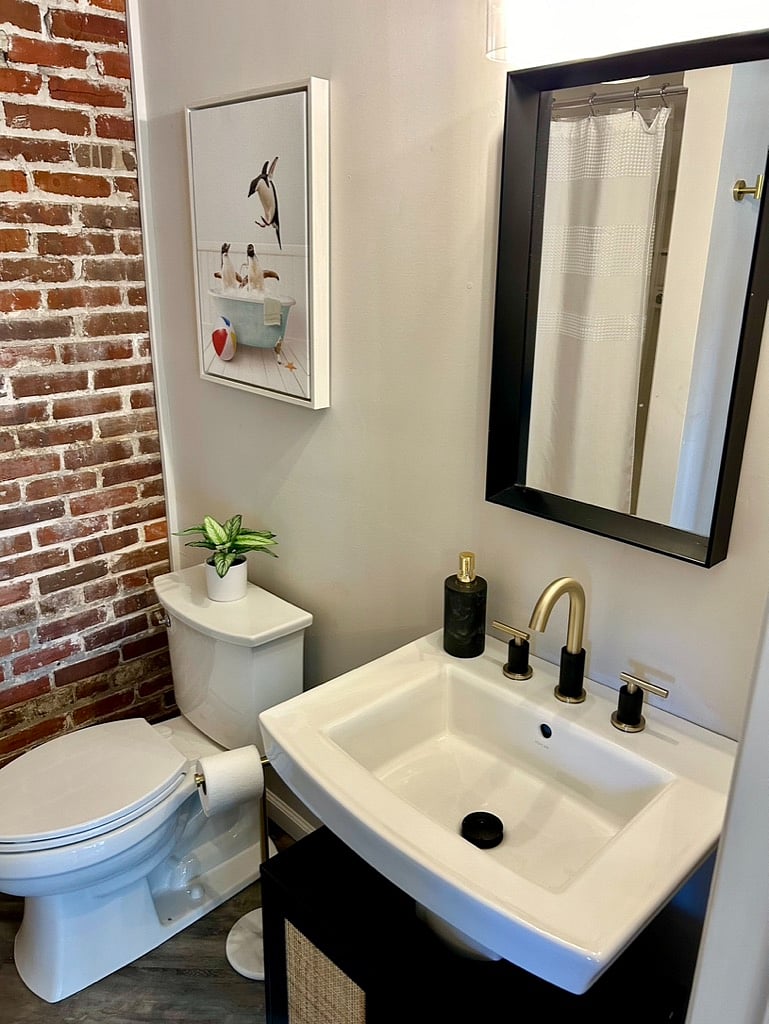 Bathroom includes walk-in shower, additional storage, plus toiletries such as shampoo, conditioner, body wash, make up wipes and more. Plenty of towels are provided for guests during their stay.