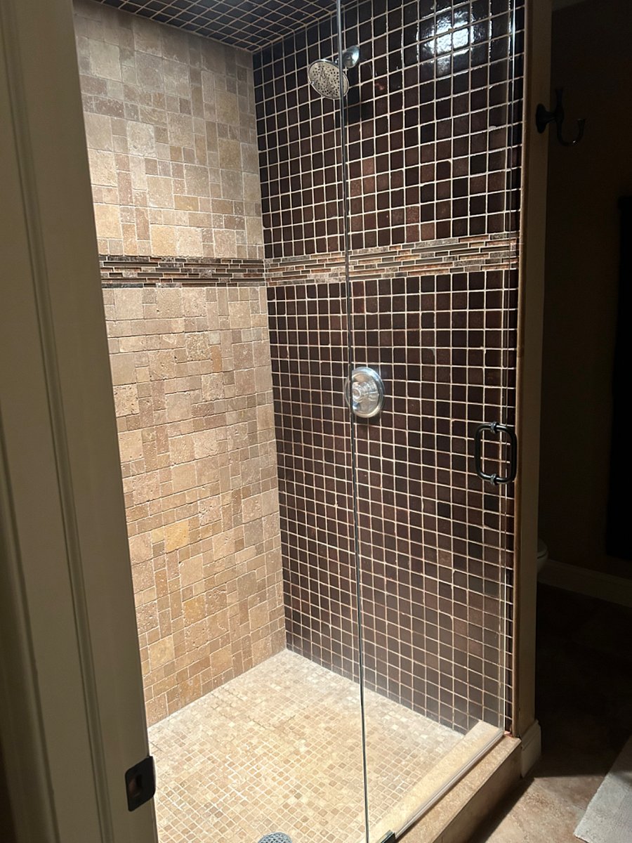 Step in shower with rain spout.