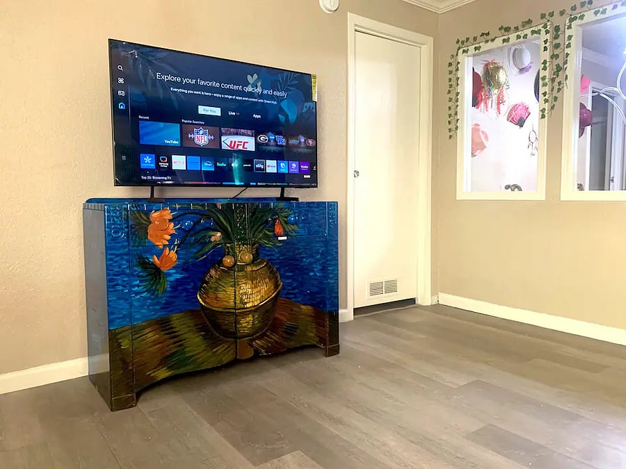 50 inch Smart Roku TV in the living room. America's #1 TV streaming platform lets you stream just about anything. Watch shows, news, movies, sports, network channels like CBS, NBC, and ABC as well as paid platforms like Netflix, Disney and Hulu.