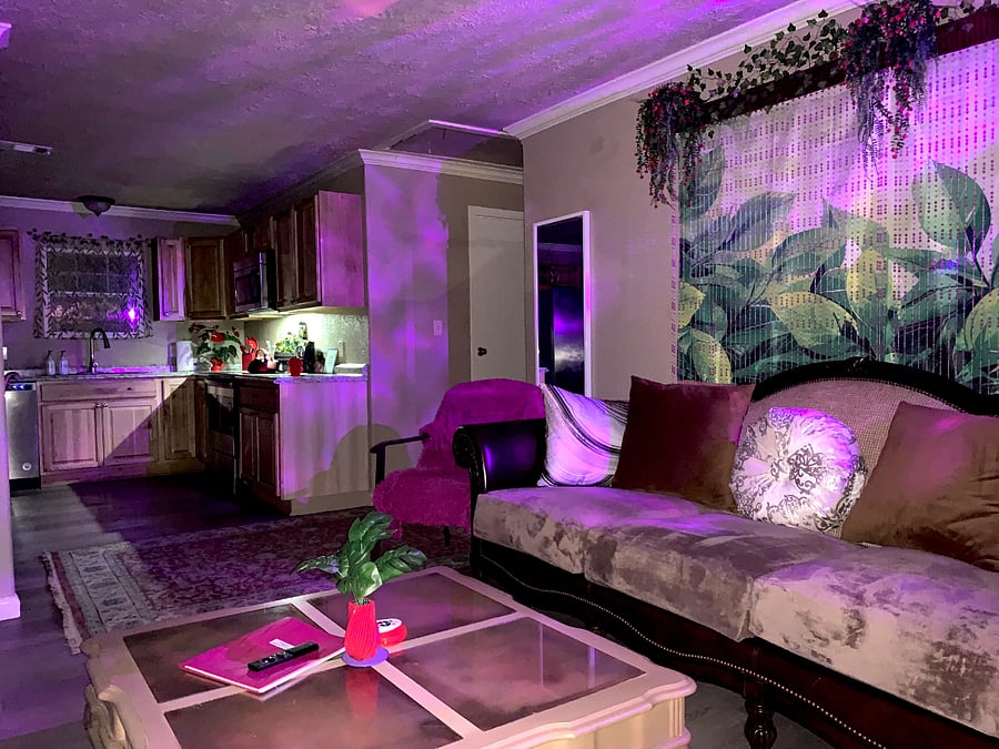 Cozy style for living room with open kitchen.
Stylish Living room: large sofa the size of a twin bed is ideal for sleeping one person.