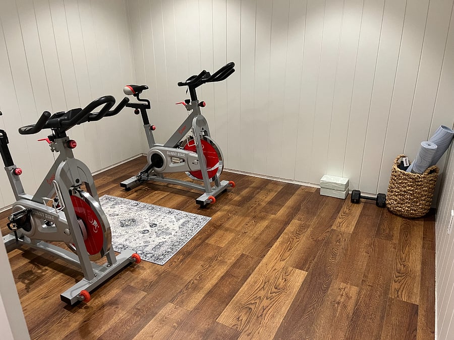 home gym with 2 spin bikes, yoga mat and yoga block