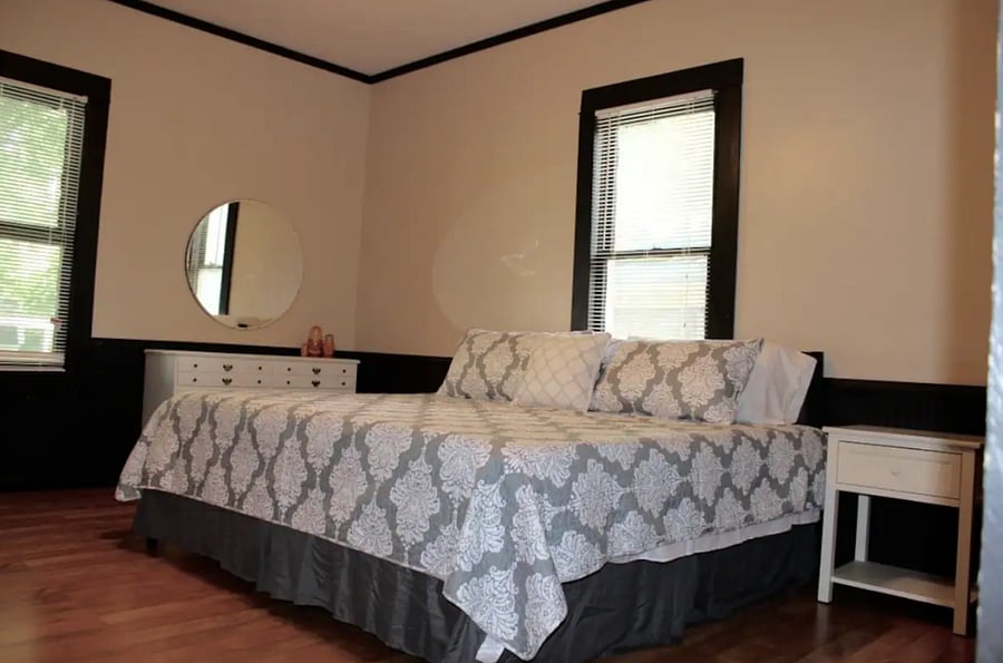Primary bedroom with king size bed and private full bath