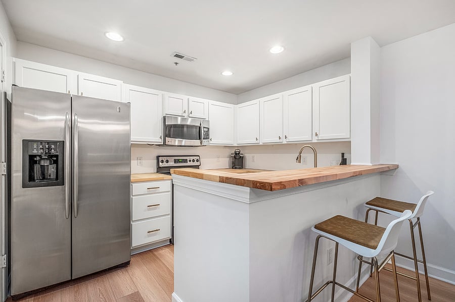 Full size refrigerator & stocked kitchen with all the basic utensils, dinnerware and pots & pans