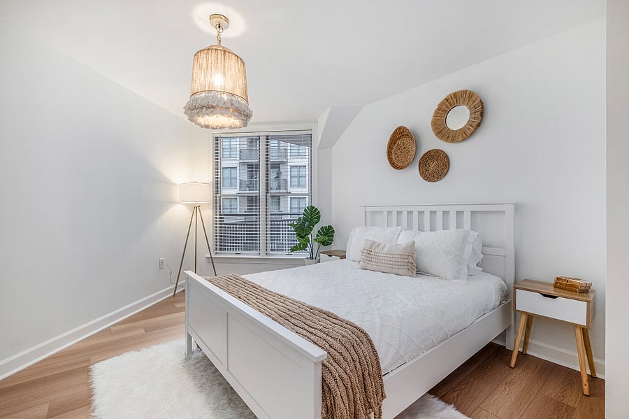 Second bedroom features queen size bed