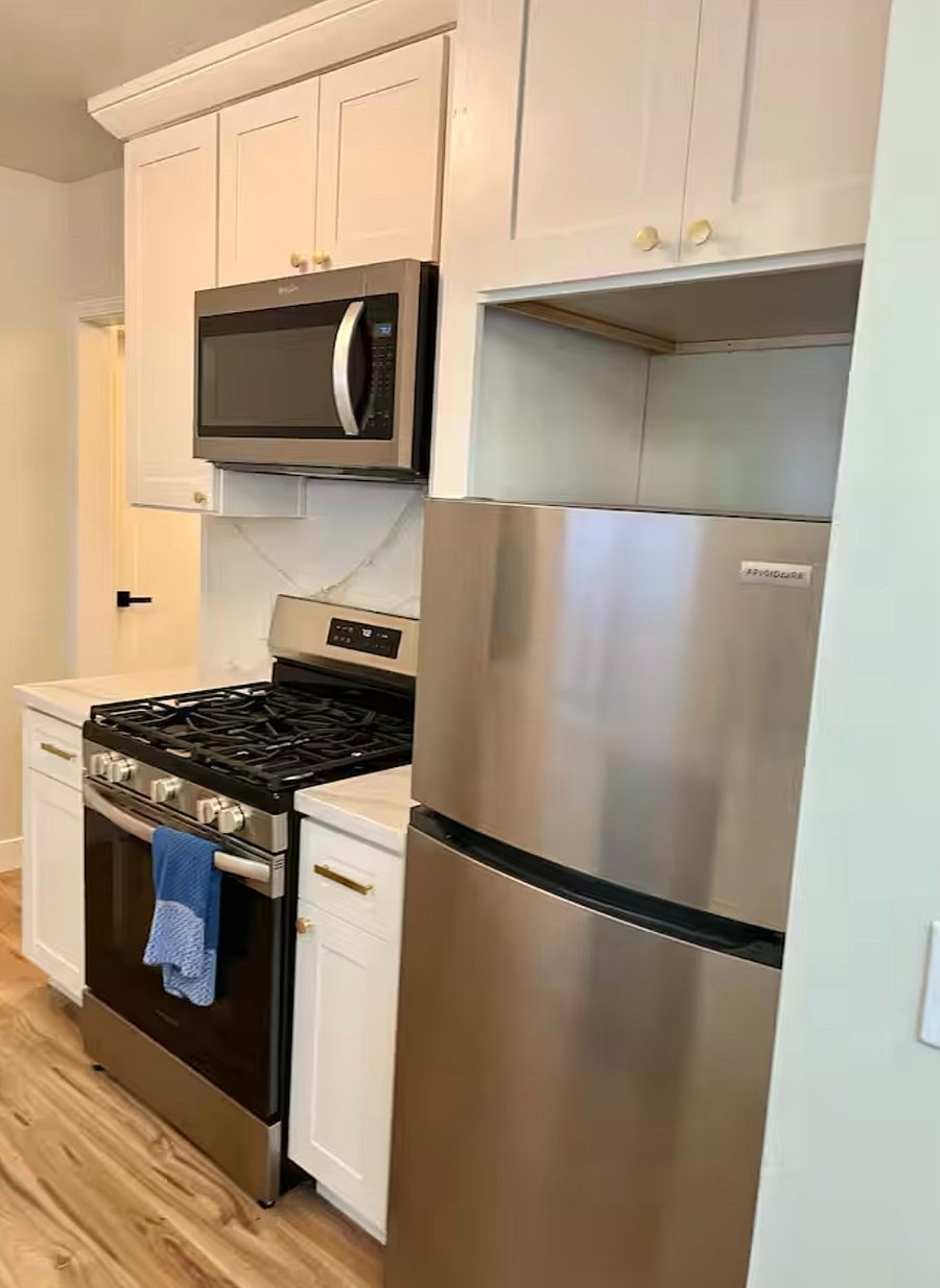 Kitchen comes with Gas range, Refridgerator with top freezer, garbage disposal, microwave, dining nook, drip coffee maker, pots pans, plats, and silverware.
